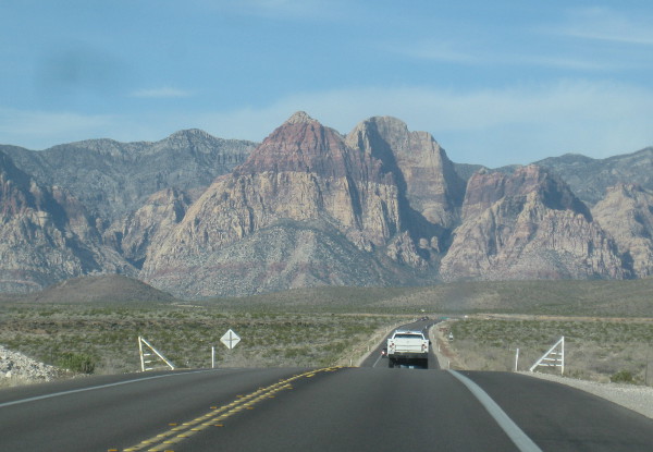 photo of the road and mountains in the background driving toward Red Rock Canyon in Nevada