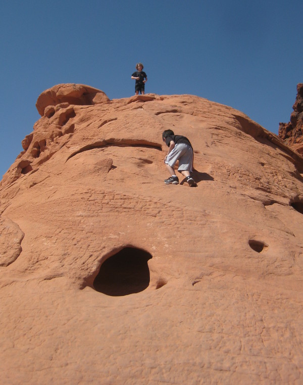 photo of children climbing the rock formation at the visitor center of the Valley of Fire