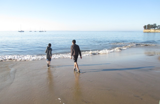image of kids playing on the beach at the Pacific Ocean