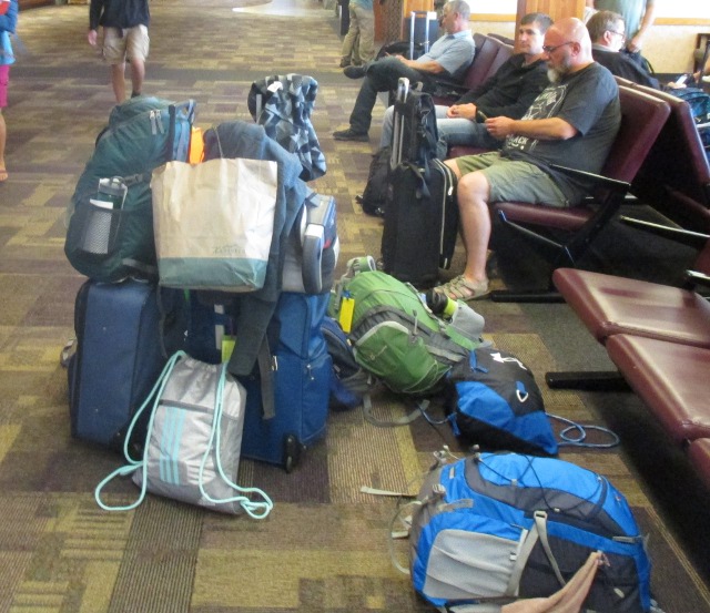 image of a pile of luggage at an airport