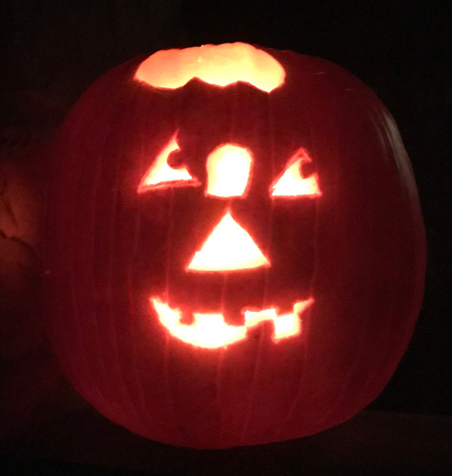 image of some carved pumpkin jack-o-lanterns during the night