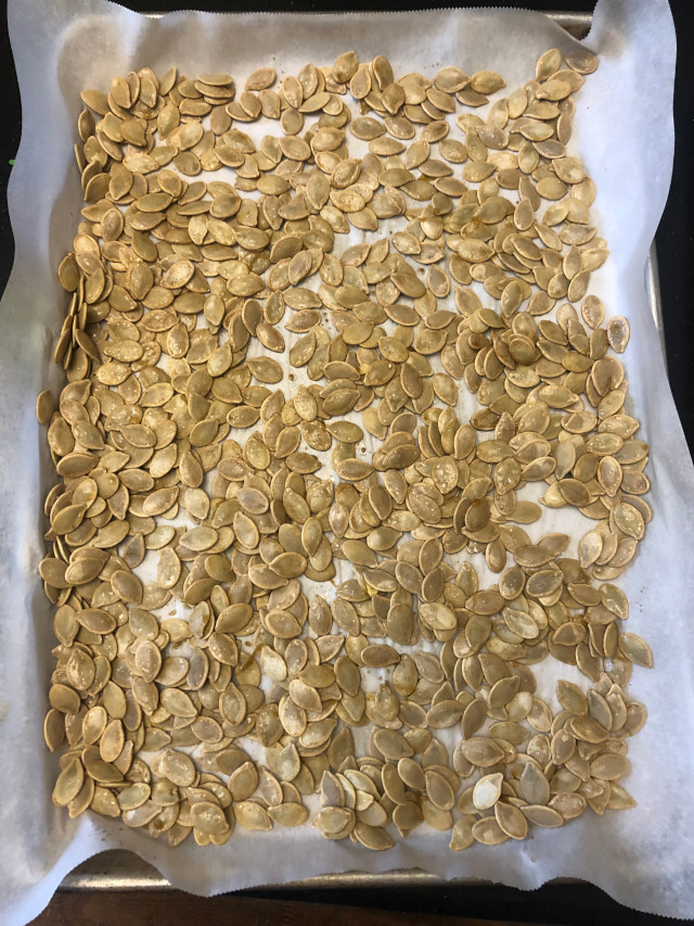 image of some pumpkin seeds being cooked
