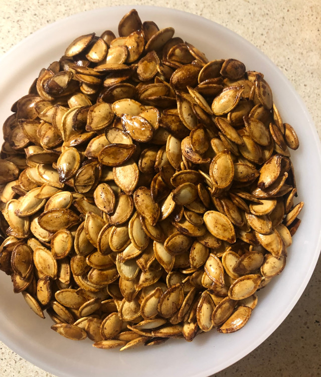 image of some baked pumpkin seeds in a bowl