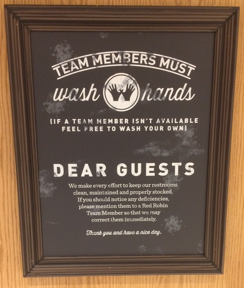 image of restaurants bathroom sign saying that employees must wash hands