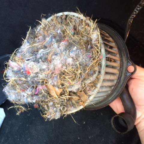 image of a mouse nest in a vehicle blower fan