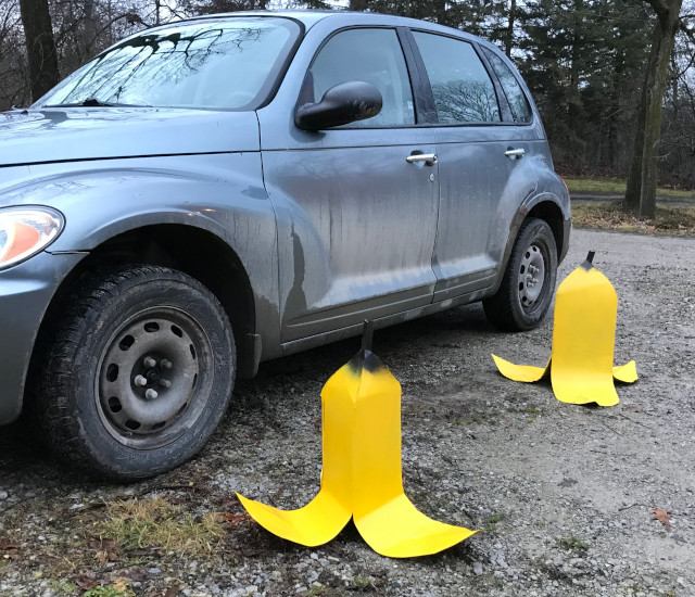 set of craft bananas next to a car