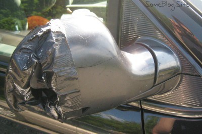 photo of a broken side-mirror housing