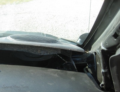 photo of opening a dashboard panel of a Dodge Grand Caravan