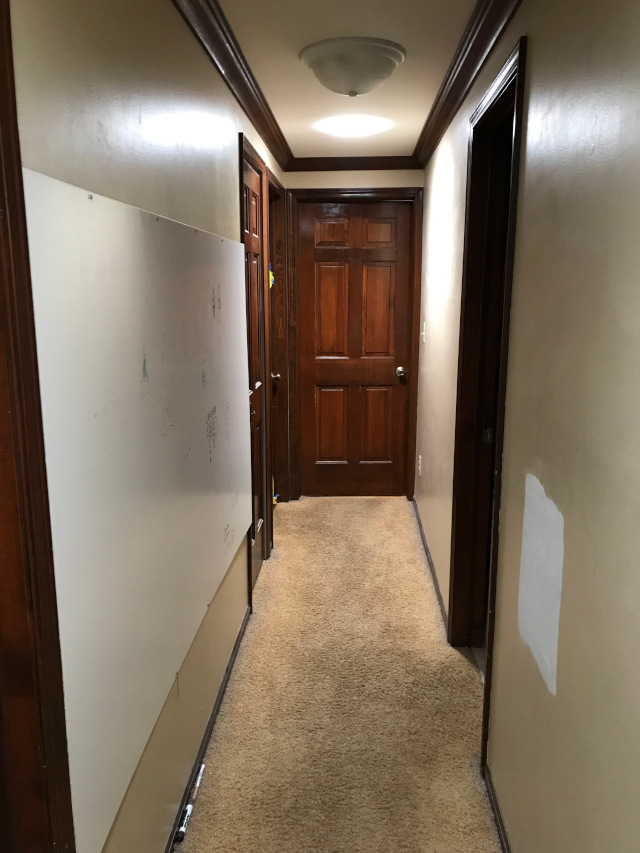 image of a hallway that is bright because of skylight tubes