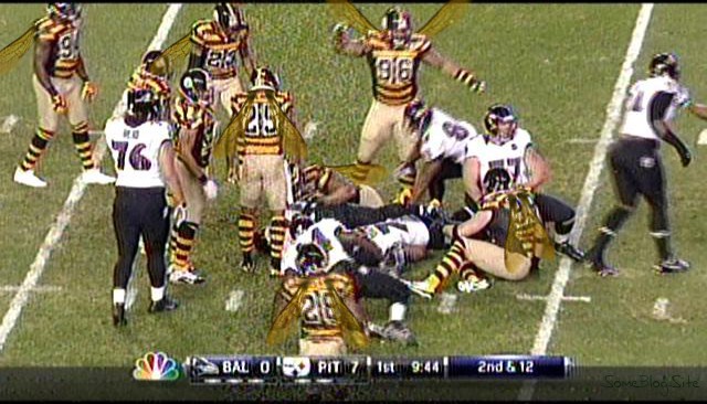 screen shot of the TV during the Pittsburgh Steelers game, with the players having wings on them to resemble bumblebees