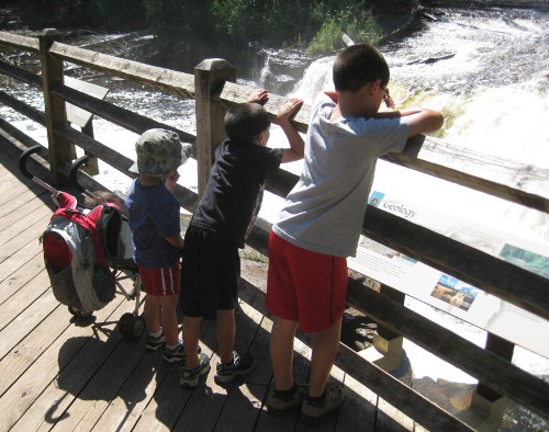 children looking at the lower Tahquamenon Falls