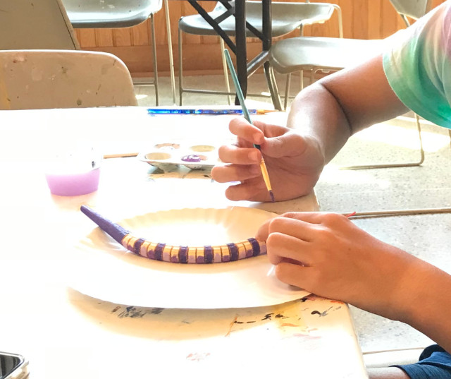 image of someone painting a craft at Maranatha Bible and Missionary Conference in Norton Shores