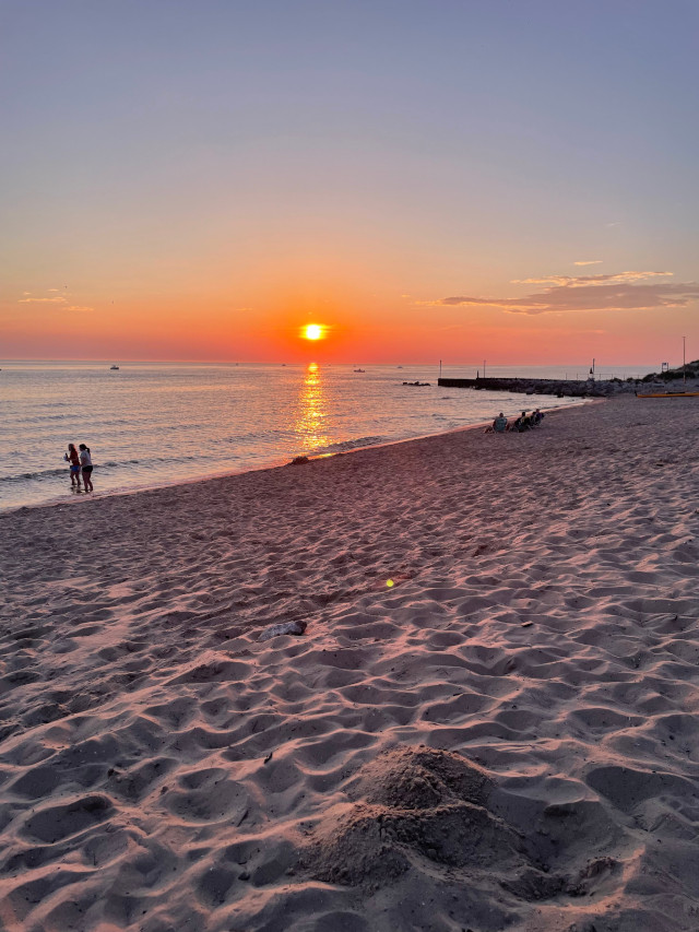 image of a sunset on the beach at Maranatha Bible and Missionary Conference in Norton Shores