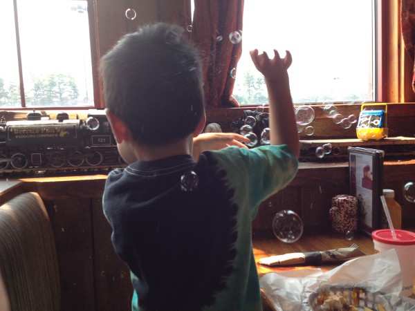 photo of model train pulling a bubble blowing machine at the Buffalo Phil's restaurant in Wisconsin Dells