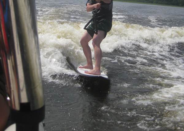 photo of someone wakesurfing