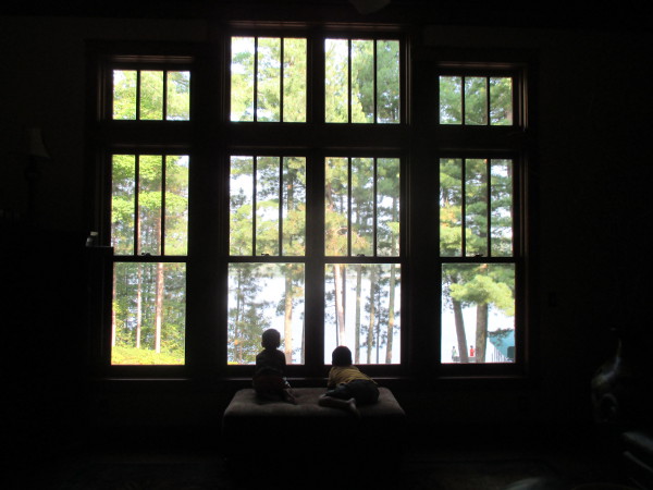 photo of kids looking out a window