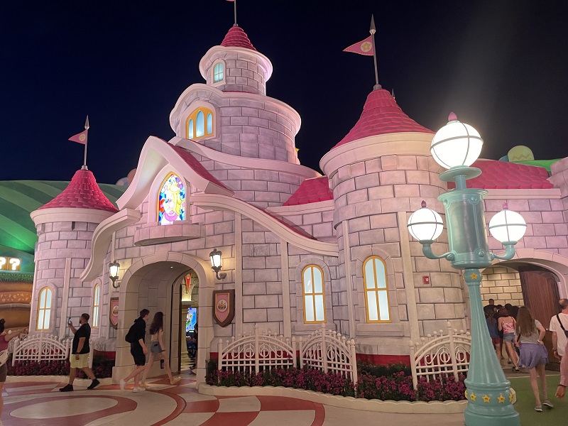 image of Princess Peach's castle at Universal Studios Epic Universe at night