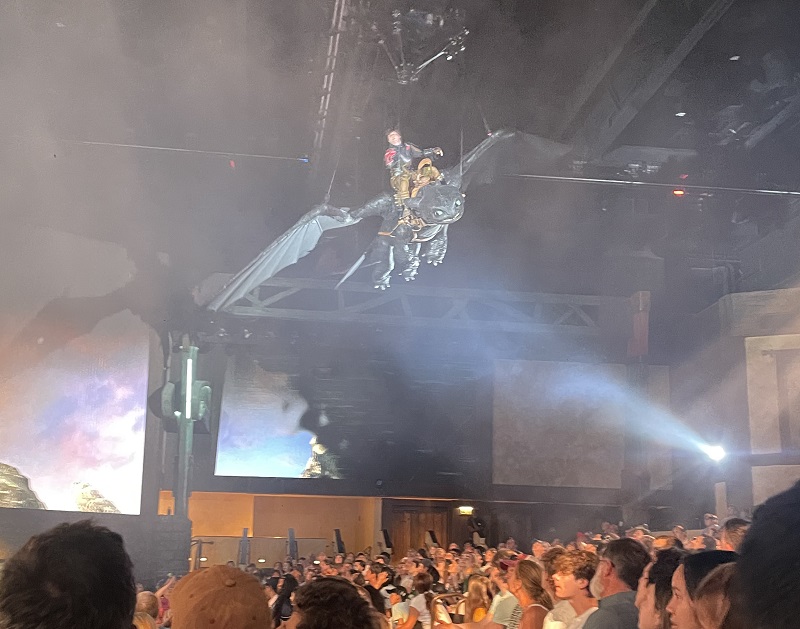 image of Toothless the dragon flying at the stage production at the Isle of Berk at Universal Studios Epic Universe