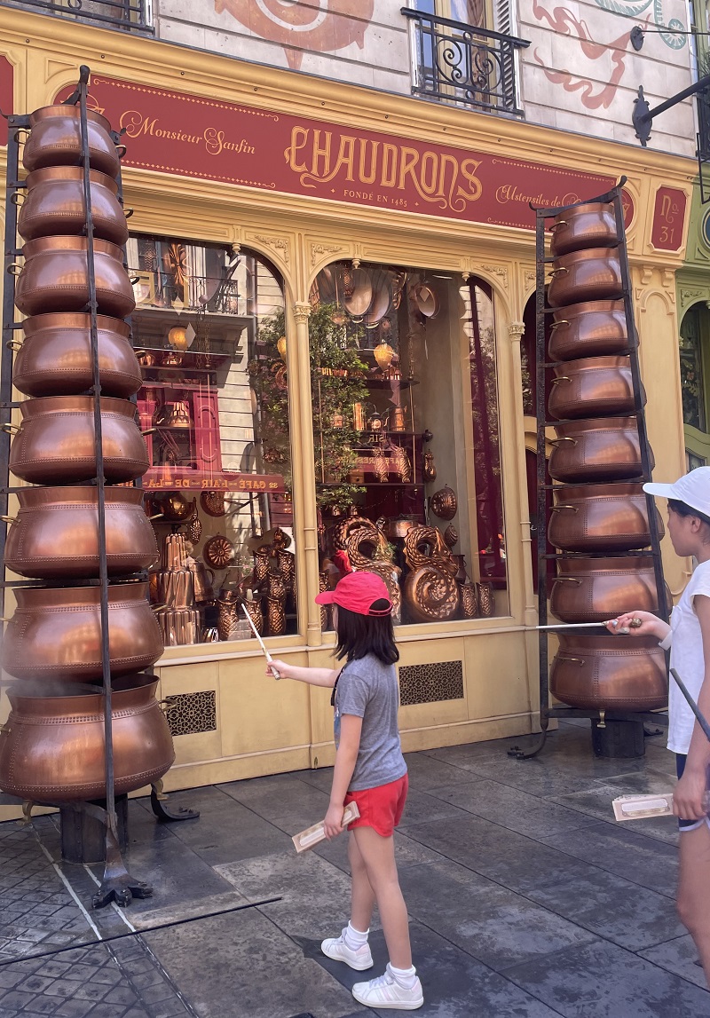 image of someone using a magic wand at Universal Studios Epic Universe